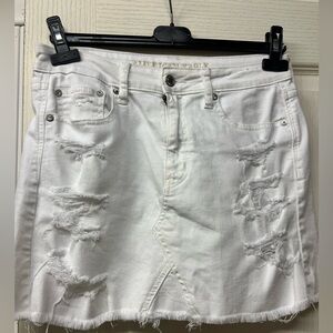 White jean skirt with rips